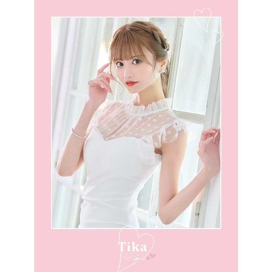 ティカ Tika シースルードット柄ハイネックフリル袖レディ