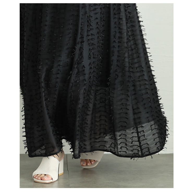 モードに揺らめくフリンジデザインシアーフレアスカート レディース