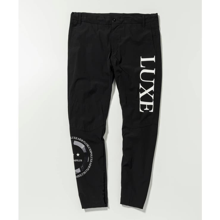 LUXEAKMPLUS リュクスエイケイエムプラス サークルロゴウィンドパンツ