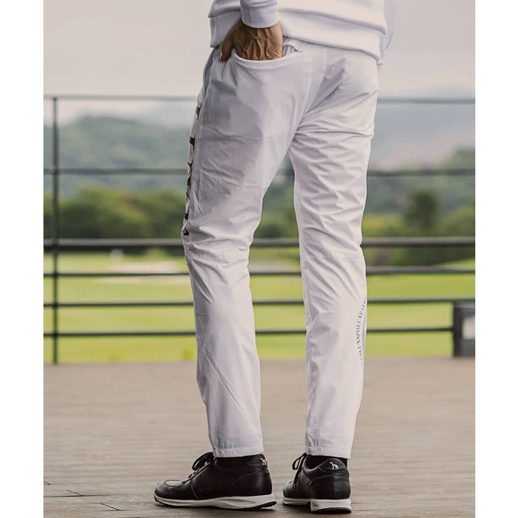 LUXEAKMPLUS リュクスエイケイエムプラス サークルロゴウィンドパンツ