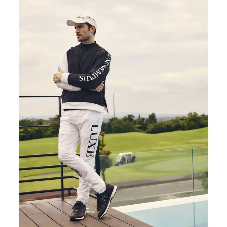 LUXEAKMPLUS リュクスエイケイエムプラス サークルロゴウィンドパンツ