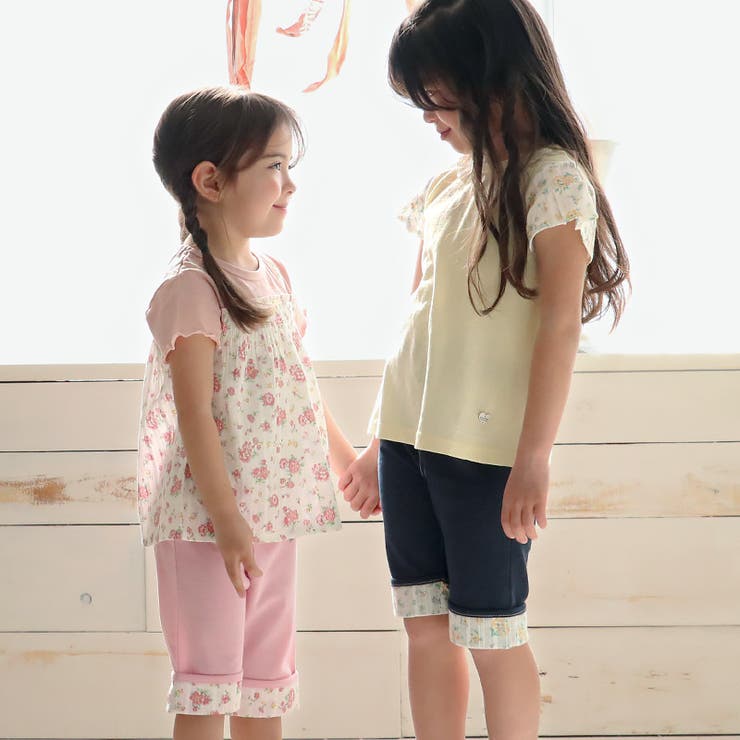 ガールズTシャツ半袖花柄フリルレイヤード風重ね着風ギャザーチュニック切り替え女の子キッズベビーチャーム付【UZULANDウズランド】半袖Tシャツフリルトップスカットソージャカード襟付きフラワー花総柄ピンクイエロー809095100110120130