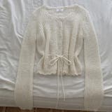 オフホワイト | Vネック長袖シングルブレストひもがある無地ニットトップス | Ulysses